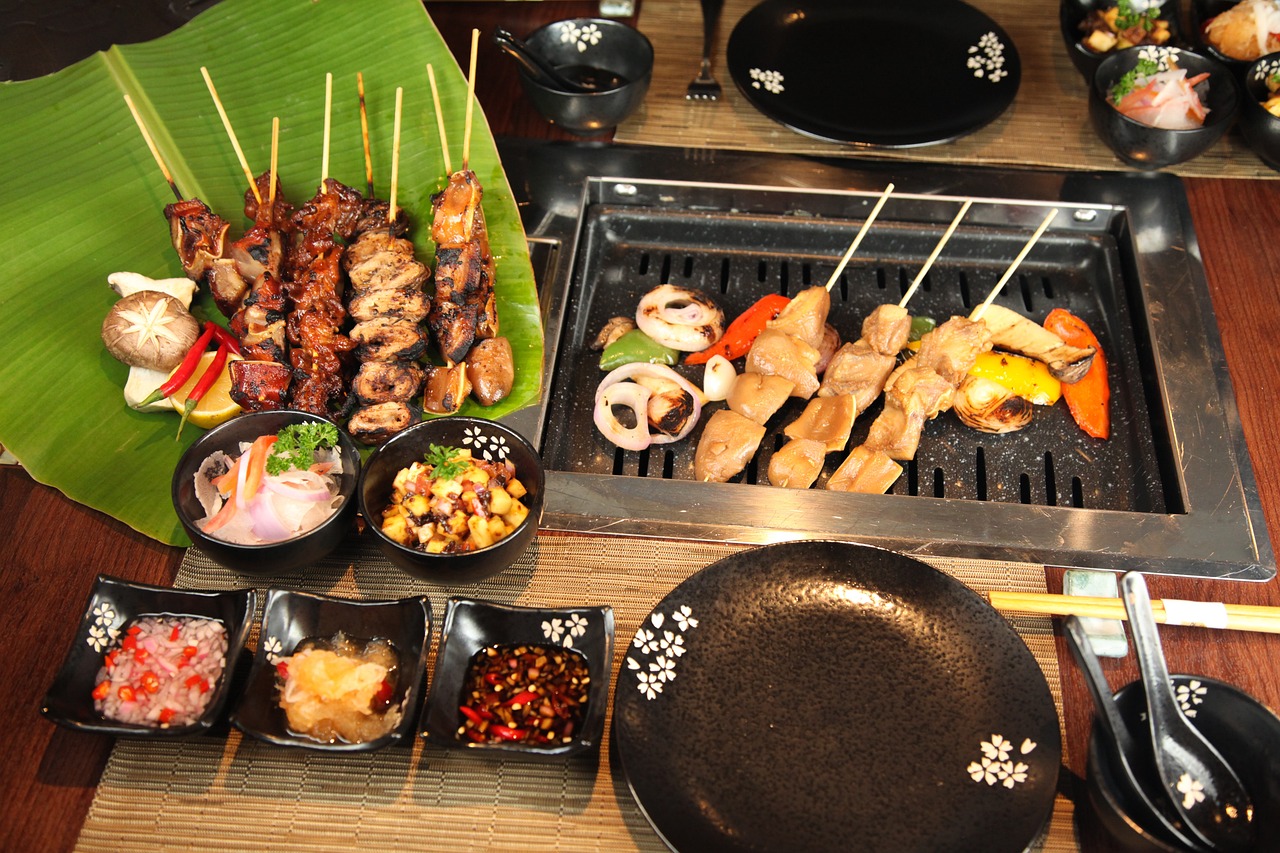A yakitori grill running on lump charcoal in a working kitchen