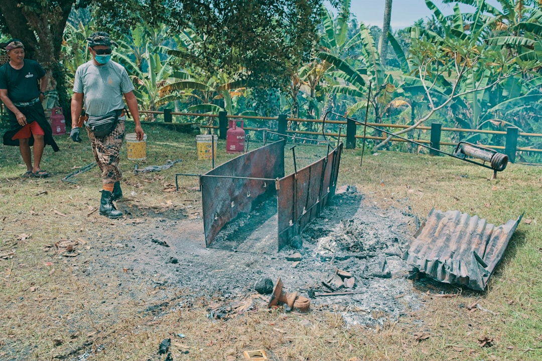 Traditional earth kiln carbonising hardwood at the factory