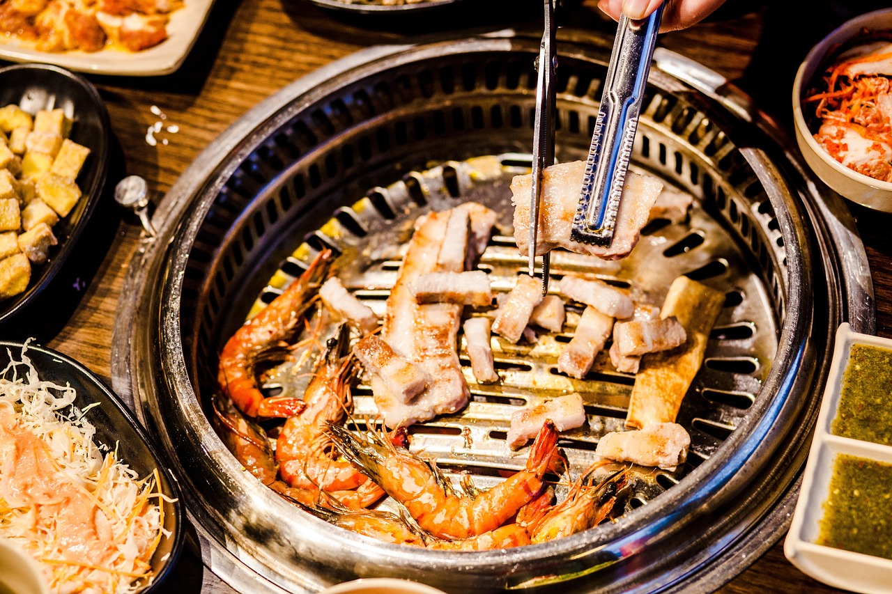 A yakitori grill running on lump charcoal in a working kitchen