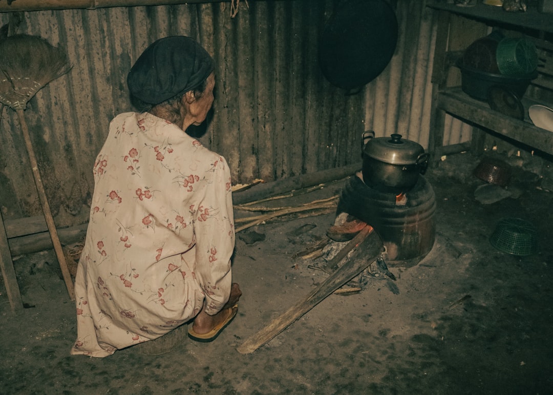 Traditional earth kiln carbonising hardwood at the factory