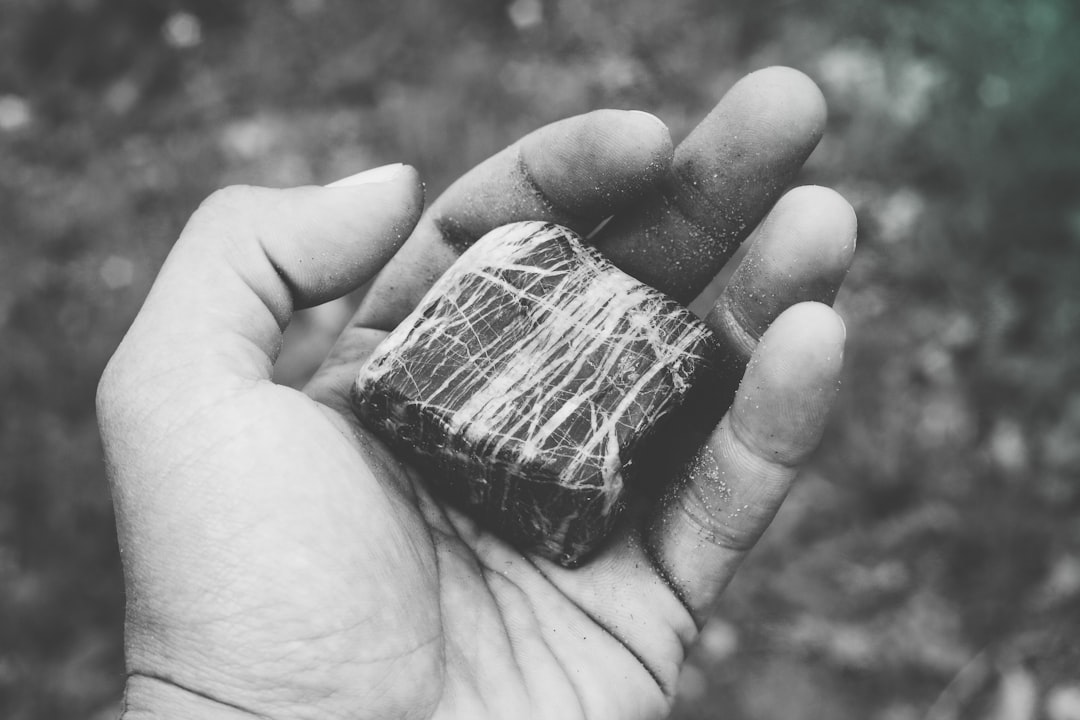 A single piece in the hand: weight, break, and surface are what expose black charcoal sold as white