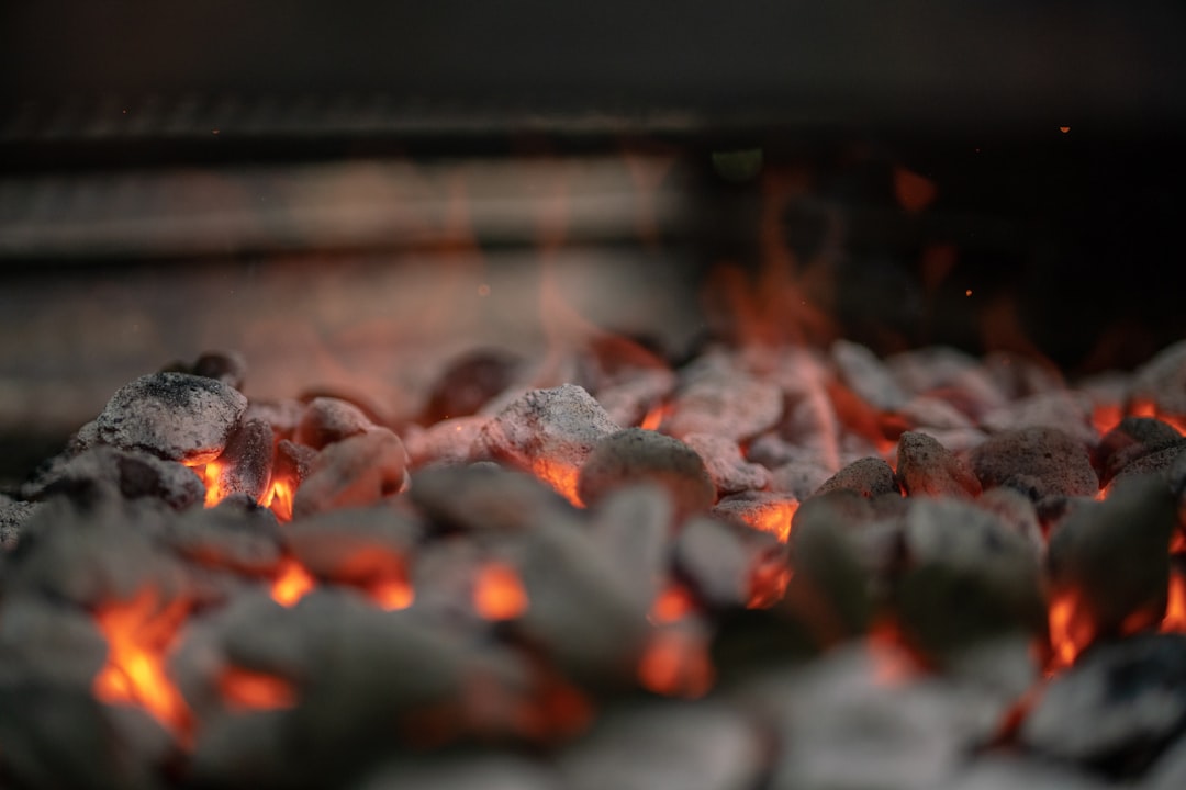 Briquettes burning down evenly, the uniform fuel lump charcoal gets judged against